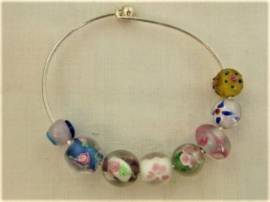 Bracelet Made Using a Selection of Glass Lampwork Beads on a Rigid Base