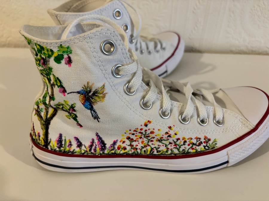 A pair of hand painted and sealed Converse high tops by Andrew Jenkins 