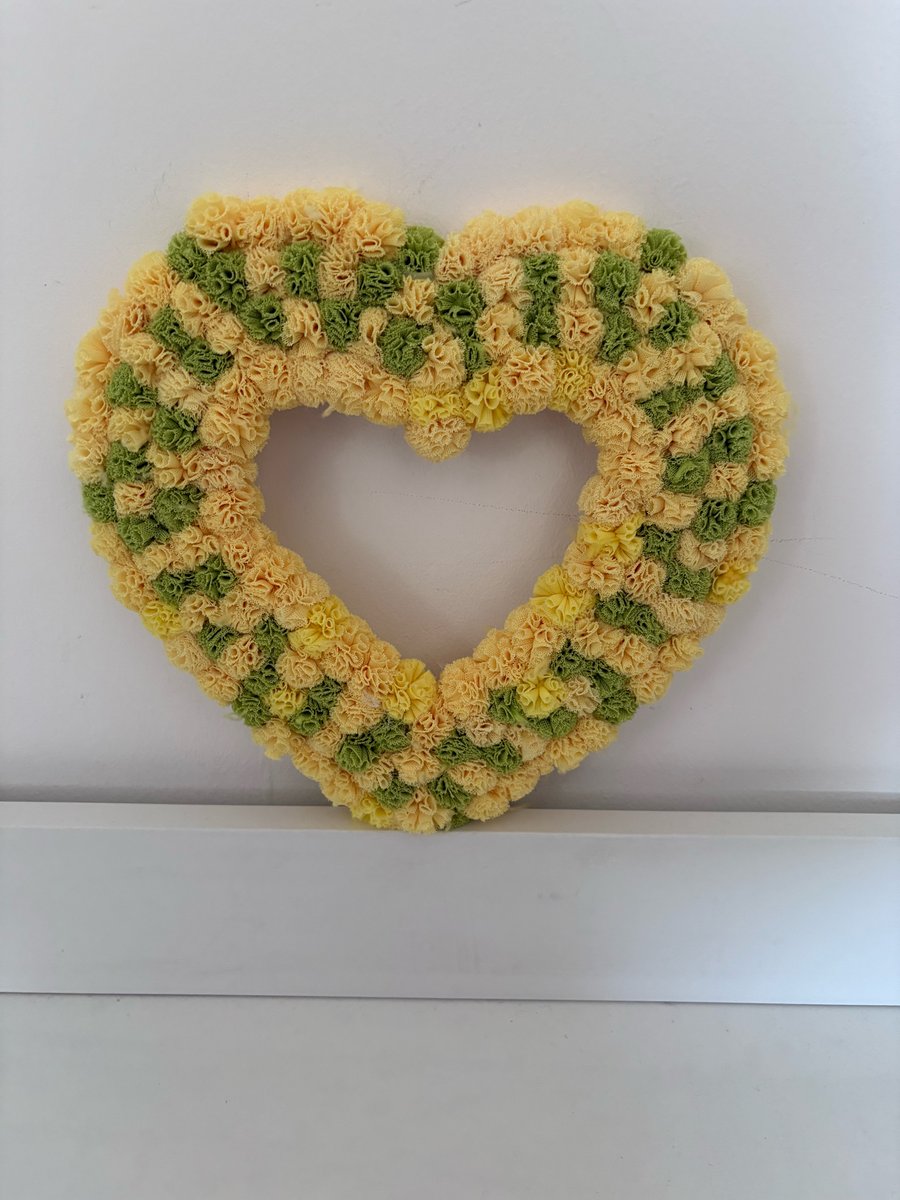 Easter Pom Pom decorated wood heart. 