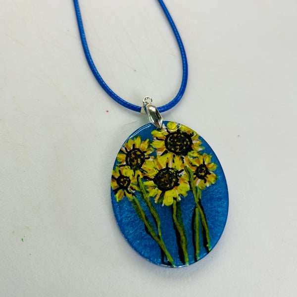 A hand painted and resin layered necklace pendant by Andrew Jenkins 