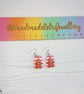 Pink and white striped gingerbread men earrings - Image 4