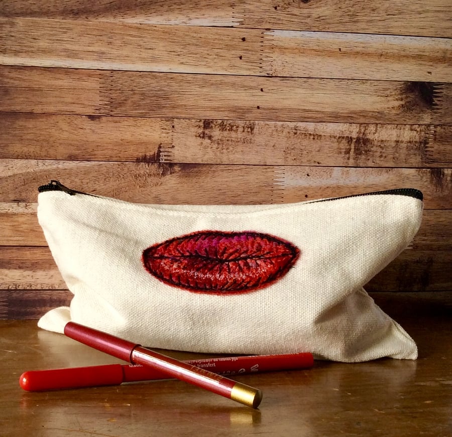 Embroidered zipped canvas make up bag, pencil case or jewellery bag.