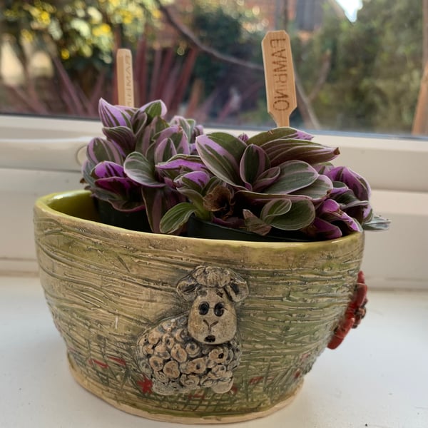 Plant pot decorated with sheep