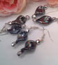 Black Iridescent Twist Bead and Silver Faceted Bead Silver Plated Earrings - Image 1