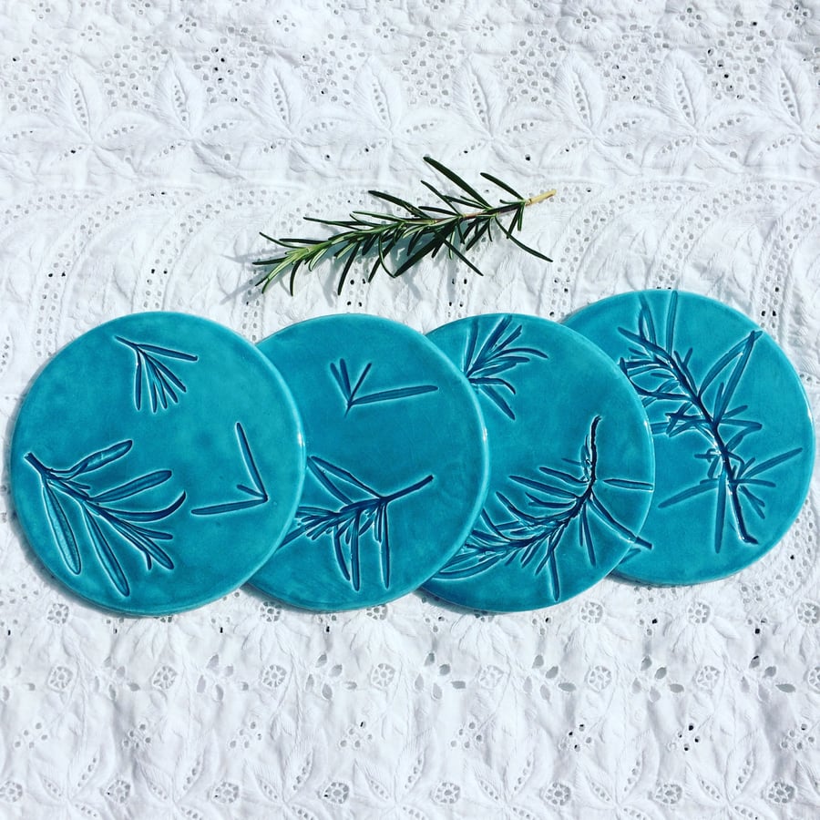 Ceramic turquoise coasters imprined with rosemary. X4