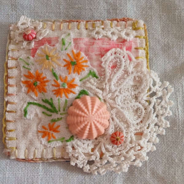 Embroidered flowers and lace textile brooch