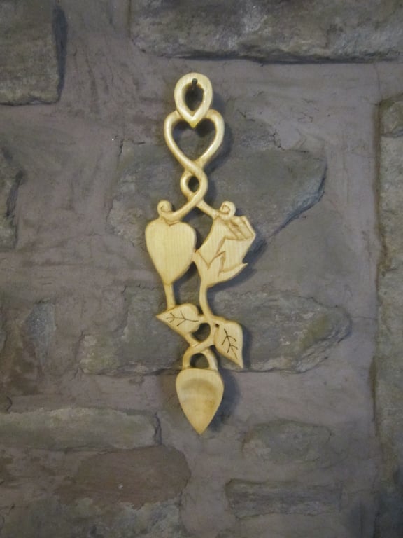 white or black rose carved wooden lovespoon