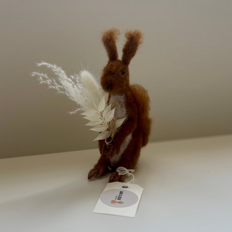 Needle felt Squirrel holding dried flowers.  Handcrafted. 16 cm tall