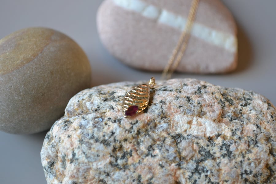 9ct gold cuttlefish cast pendant with ruby, ripple, textured, red and gold, prec