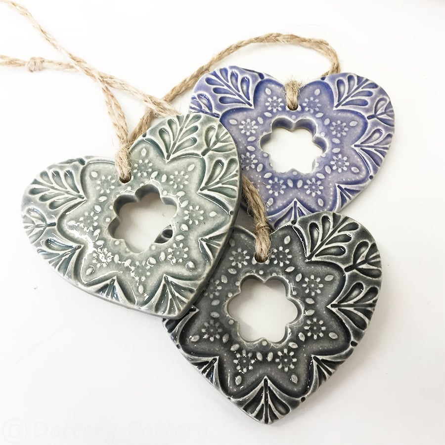 Set of three small Ceramic heart hanging decorations in purples and grey