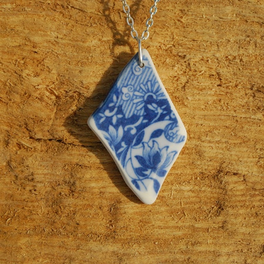 Beach pottery pendant with blue flowers