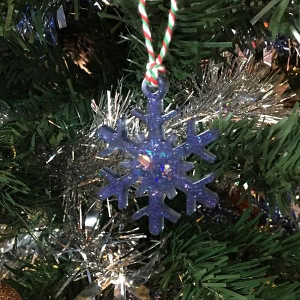 Purple moonlight snowflake Christmas tree decoration.