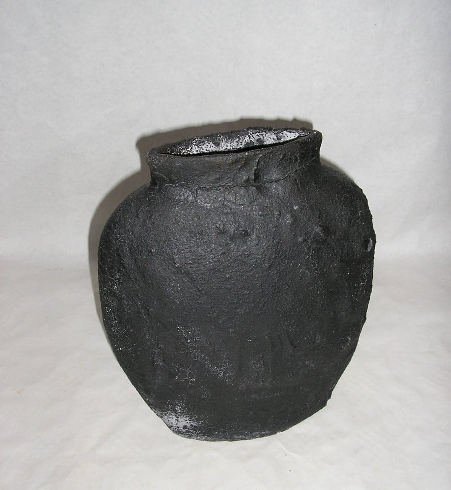 POTTERY OFF CENTRE EARTHENWARE VASE 24 CMS HIGH WITH BLACK LAVA "CRUMBLE" GLAZE