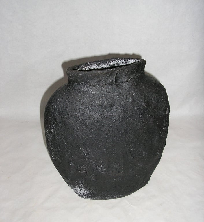 POTTERY OFF CENTRE EARTHENWARE VASE 24 CMS HIGH WITH BLACK LAVA "CRUMBLE" GLAZE