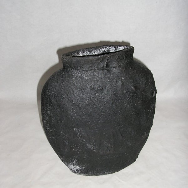 POTTERY OFF CENTRE EARTHENWARE VASE 24 CMS HIGH WITH BLACK LAVA "CRUMBLE" GLAZE