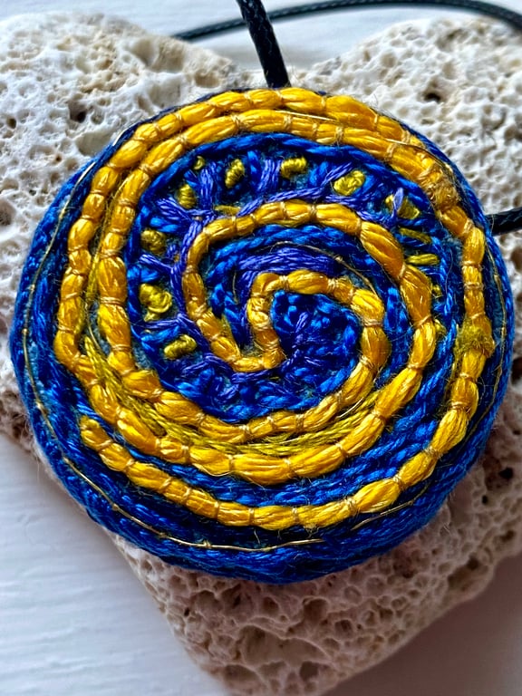 Blue and yellow swirl, hand embroidered pendant