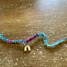 Multicolor Braided Friendship Bracelet with Gold Rainbow Charm
