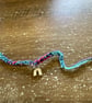 Multicolor Braided Friendship Bracelet with Gold Rainbow Charm