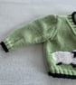 Green baby cardigan with sheep designs on the front - Image 3