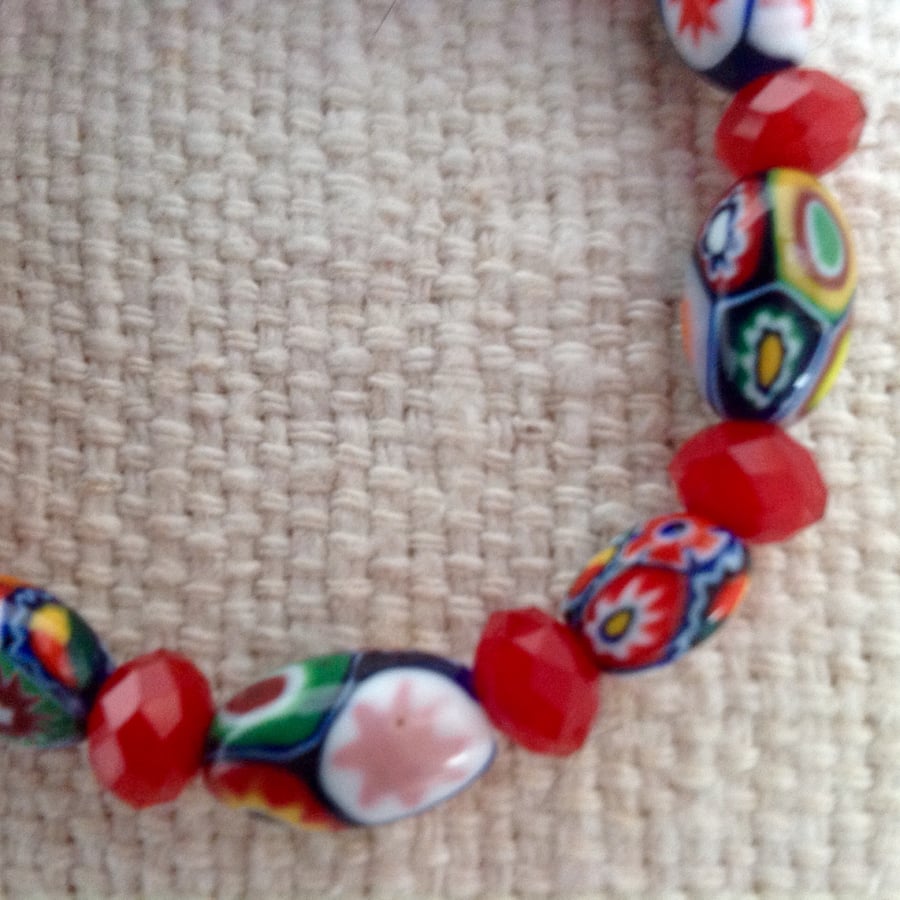 Small Millefiori vintage bead bracelet with faceted red beads on strong cord