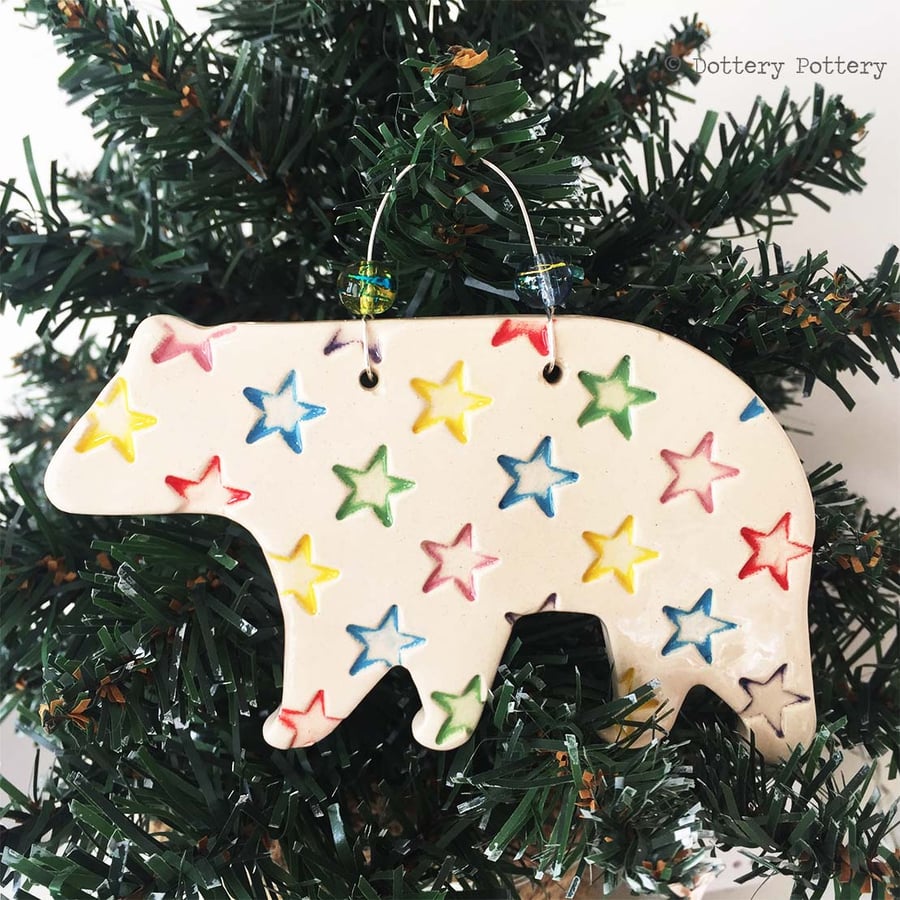 Ceramic Polar Bear with bright star design. Pottery Christmas decoration bear
