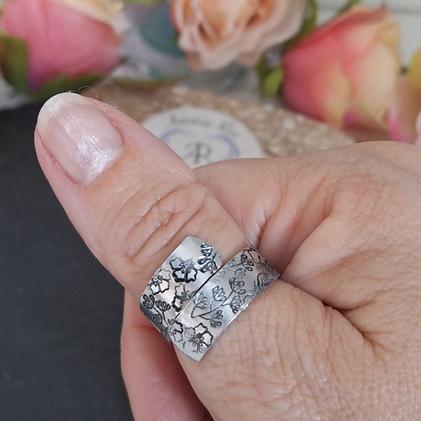 Adjustable wrap ring with a handstamped floral pattern