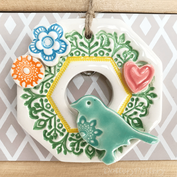 Small Ceramic wreath decoration with bird, flowers and heart