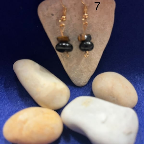 Beautiful dangling earrings with  brown and black stones.