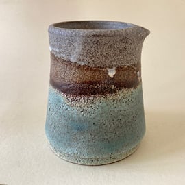 Turquoise and brown textured pourer.