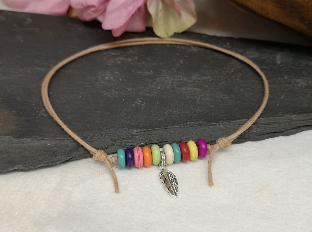 Adjustable cotton cord anklet with rainbow howlite beads and feather charm