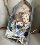 Paper mache sleeping hare under handmade quilt - Image 1