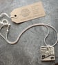 Handmade Ceramic Landscape pendant in black, white and grey - Image 2