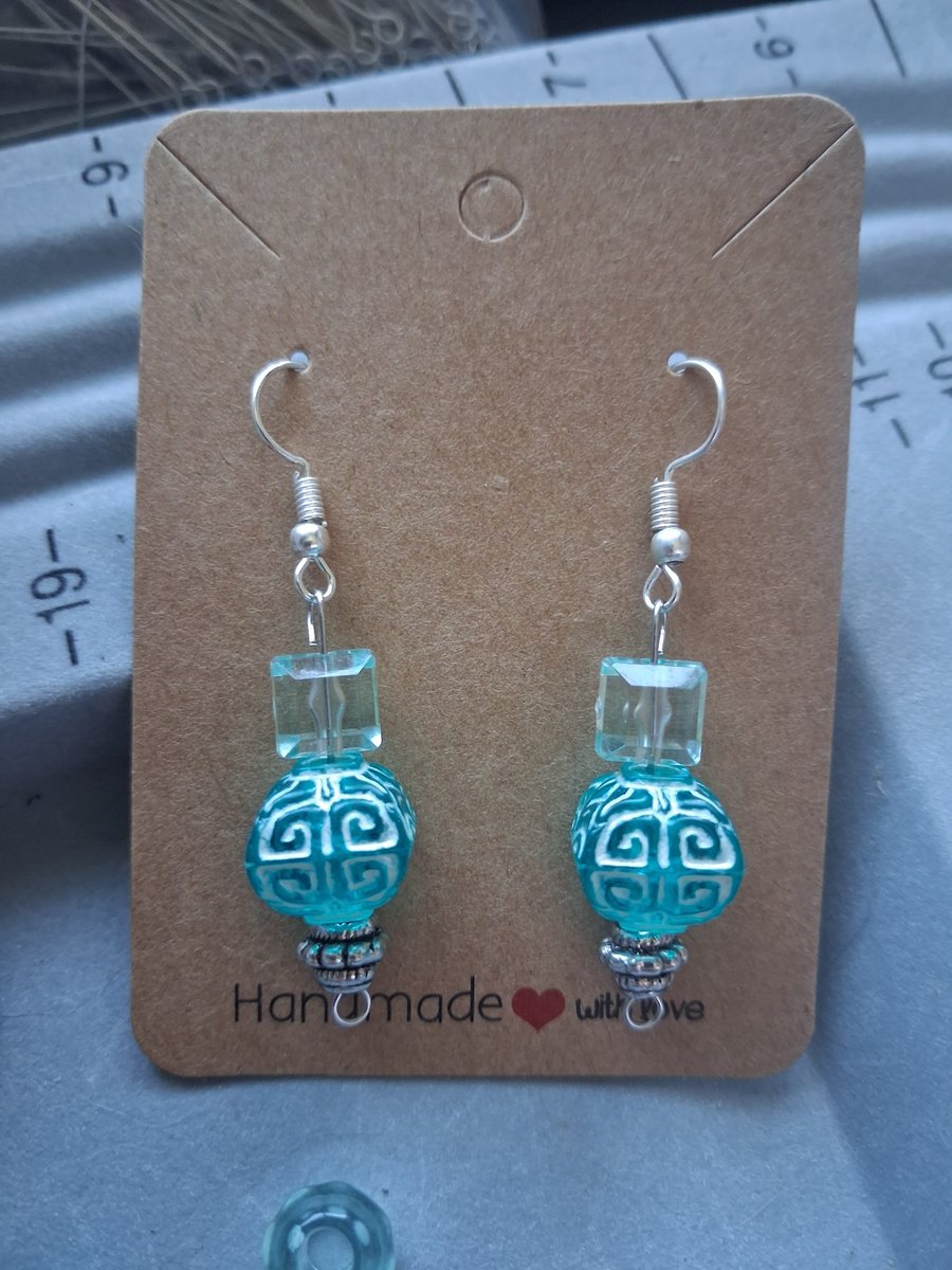 turquoise blue glass and patterned dangle earring
