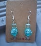 turquoise blue glass and patterned dangle earring