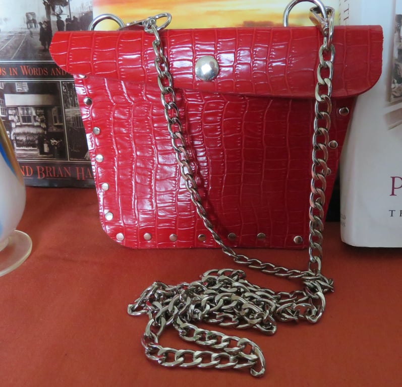 Crossbody faux leather bright red studded bag.