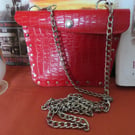Crossbody faux leather bright red studded bag.