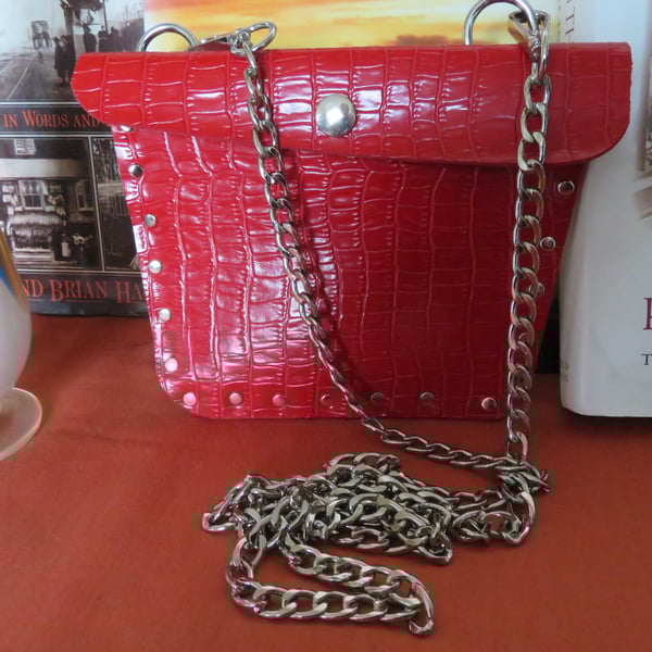 Crossbody faux leather bright red studded bag.