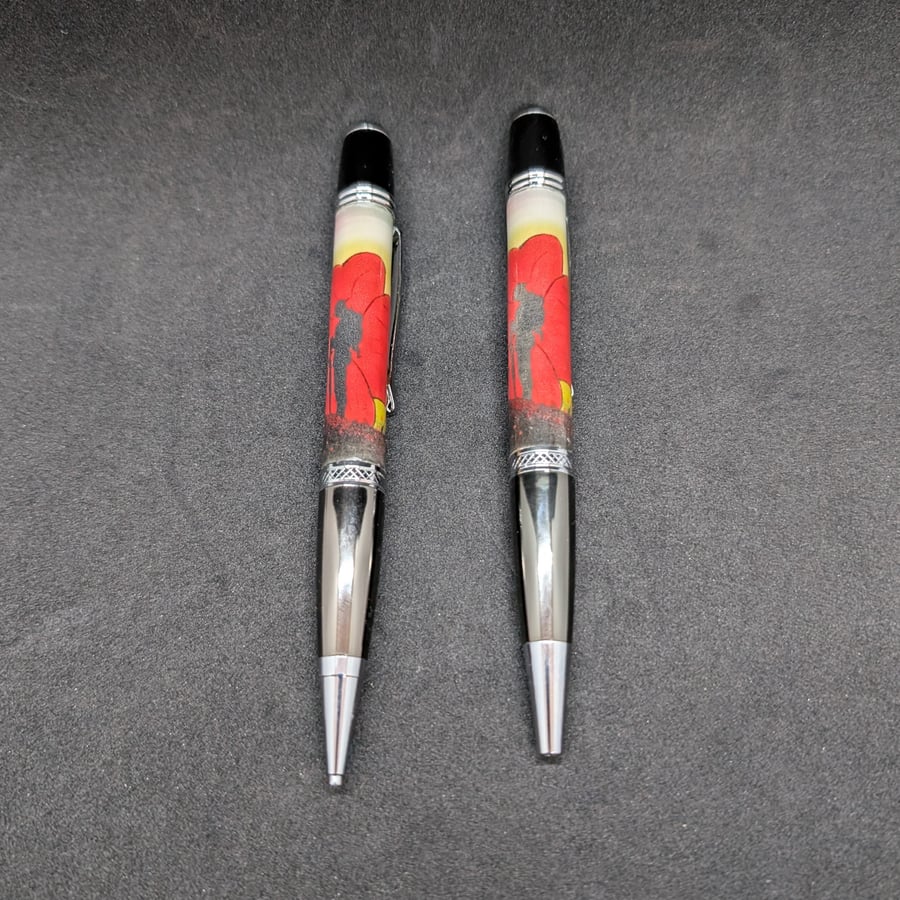 Resin pen and pencil set with an image of a soldier silhouette and a poppy