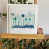 Shades of blue and green buttons and butterflies greetings card