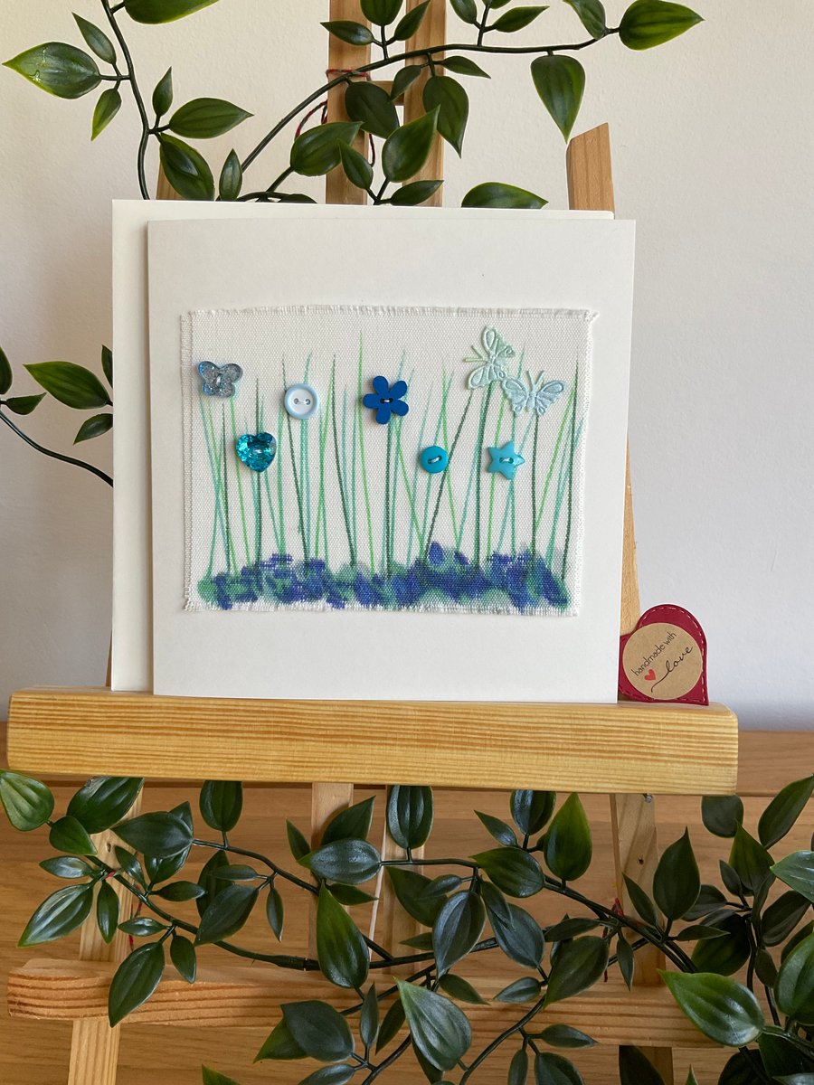 Shades of blue and green buttons and butterflies greetings card