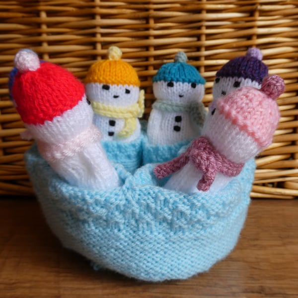 Handmade knitted snowmen in drawstring bag