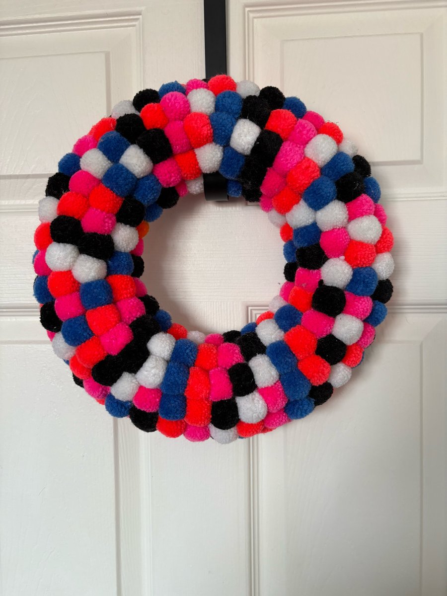 Neon coloured wool Pom Pom wreath. 