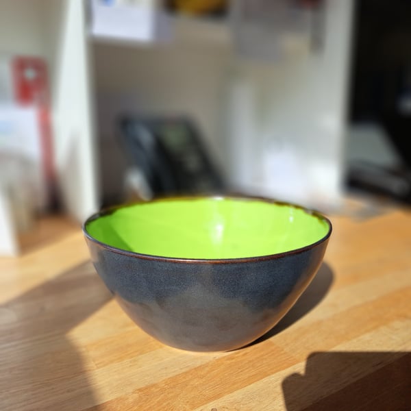 A HAND THROWN LARGE SALAD BOWL - glazed in green and charcoal