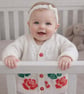 White cardigan, with standout English Rose motif. Soft and comfortable, fun gift