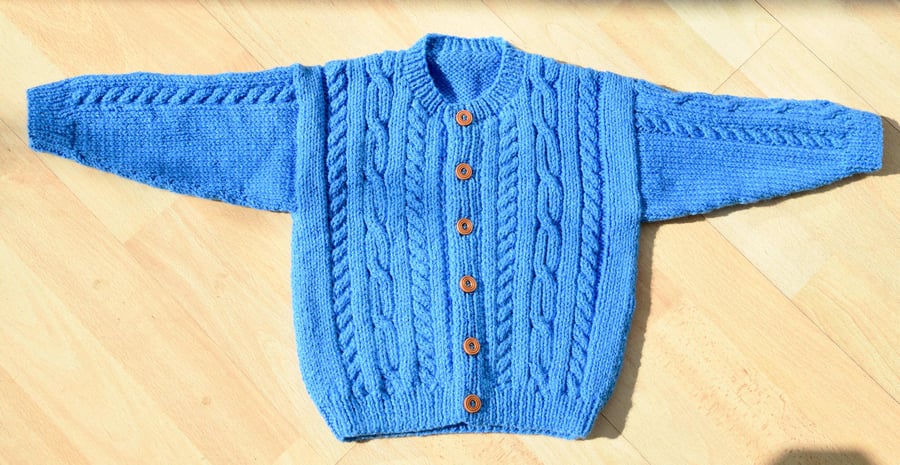 hand knitted baby cardigan with aran style pattern to fit age 1 to 2 years