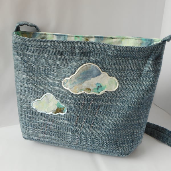 Fabric shoulder bag in blue tweedy fabric with applique clouds