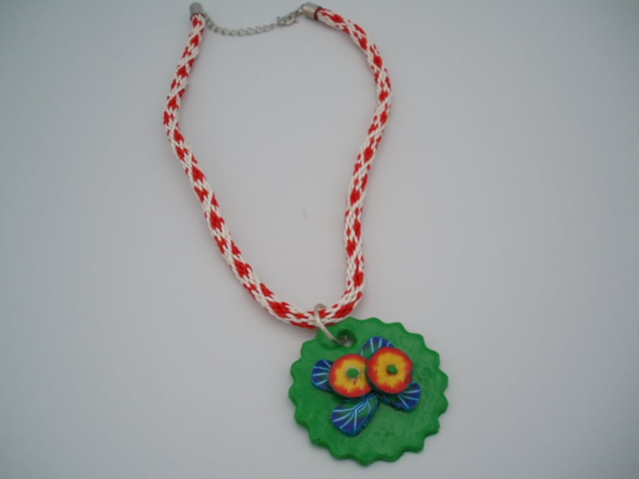 Kumihimo Braid with flowery polymer clay pendant