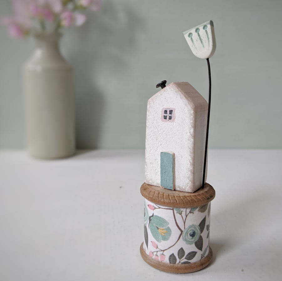 Wooden House on a Vintage Floral Bobbin with Clay Flower