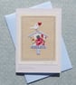 Hand-stitched miniature applique embroidery mounted on greeting card 