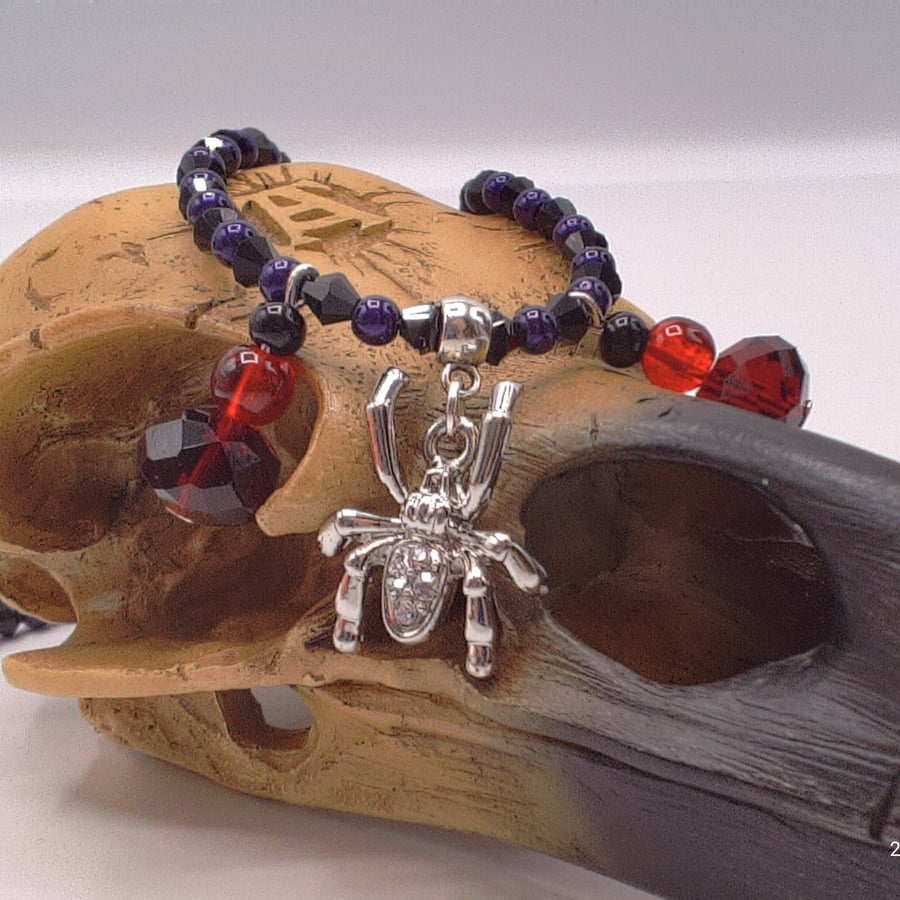 Sparkly Spider Pendant on a Purple and Black Necklace with Red & Black Charms